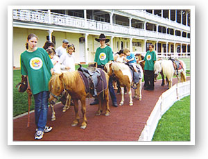 Pony rides with handlers at a real Sydney event